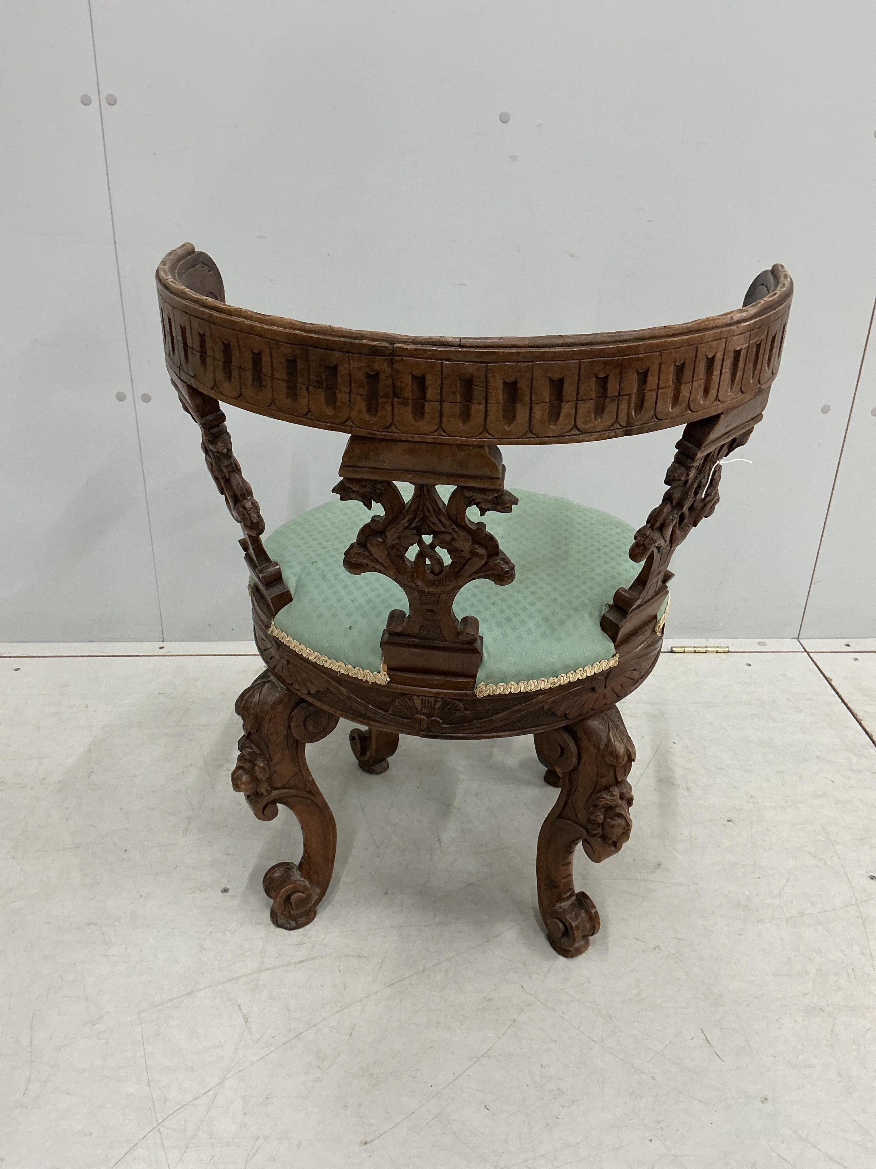 A late 19th century Italian carved walnut tub framed chair, width 61cm, depth 51cm, height 79cm